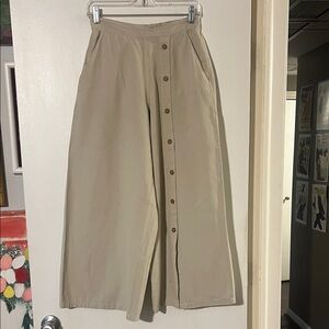 Simply Cotton elastic back waist wide leg pants w/ button detail. Front pockets
